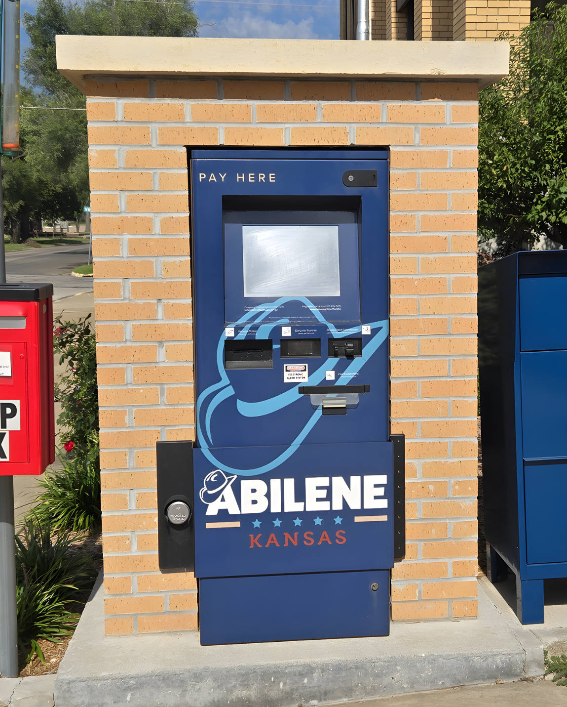 Abilene utility payment kiosk outside City Hall labeled “Pay Here.”