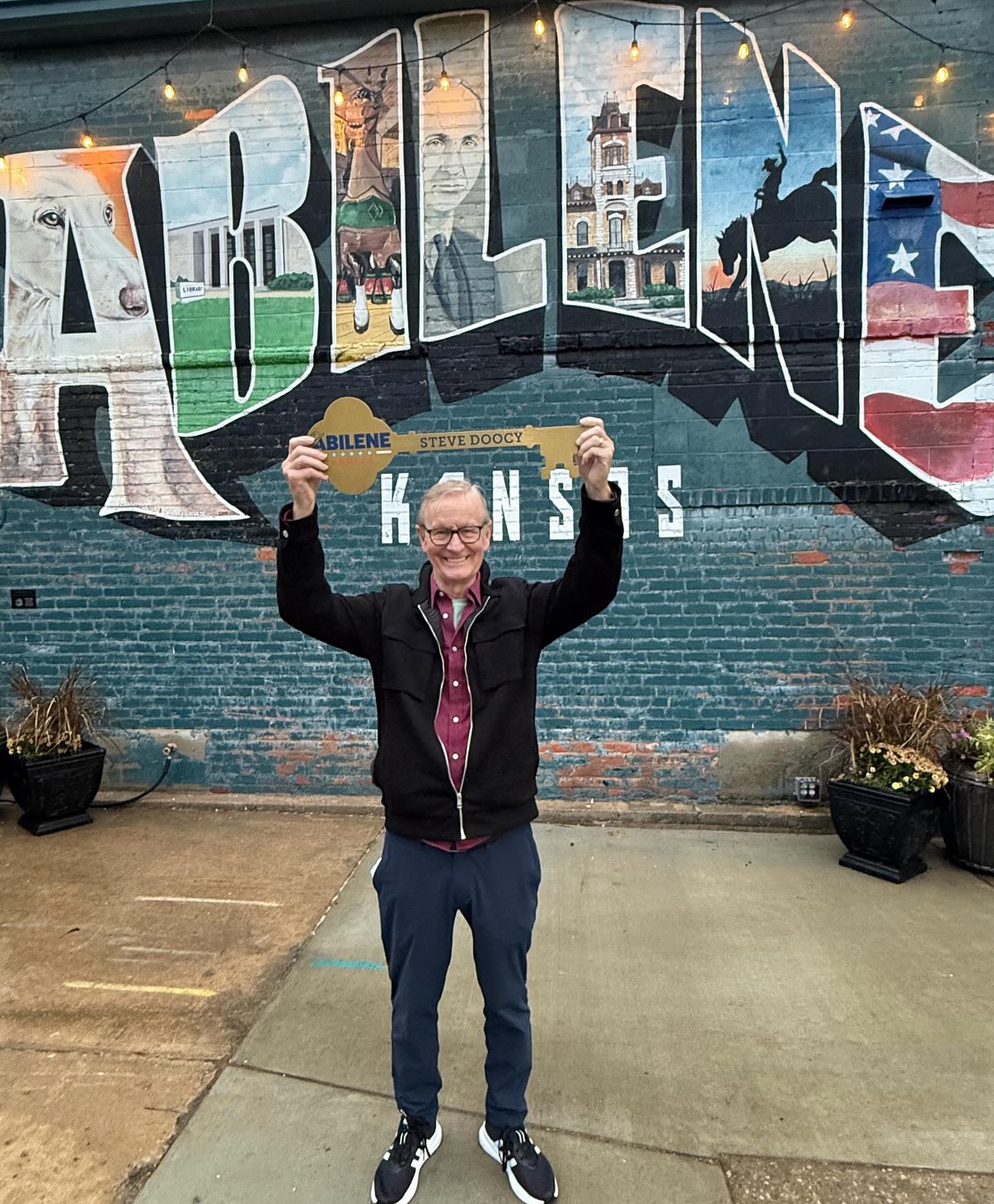 Steve Doocy large key-shaped plaque that reads “Abilene, Kansas”.