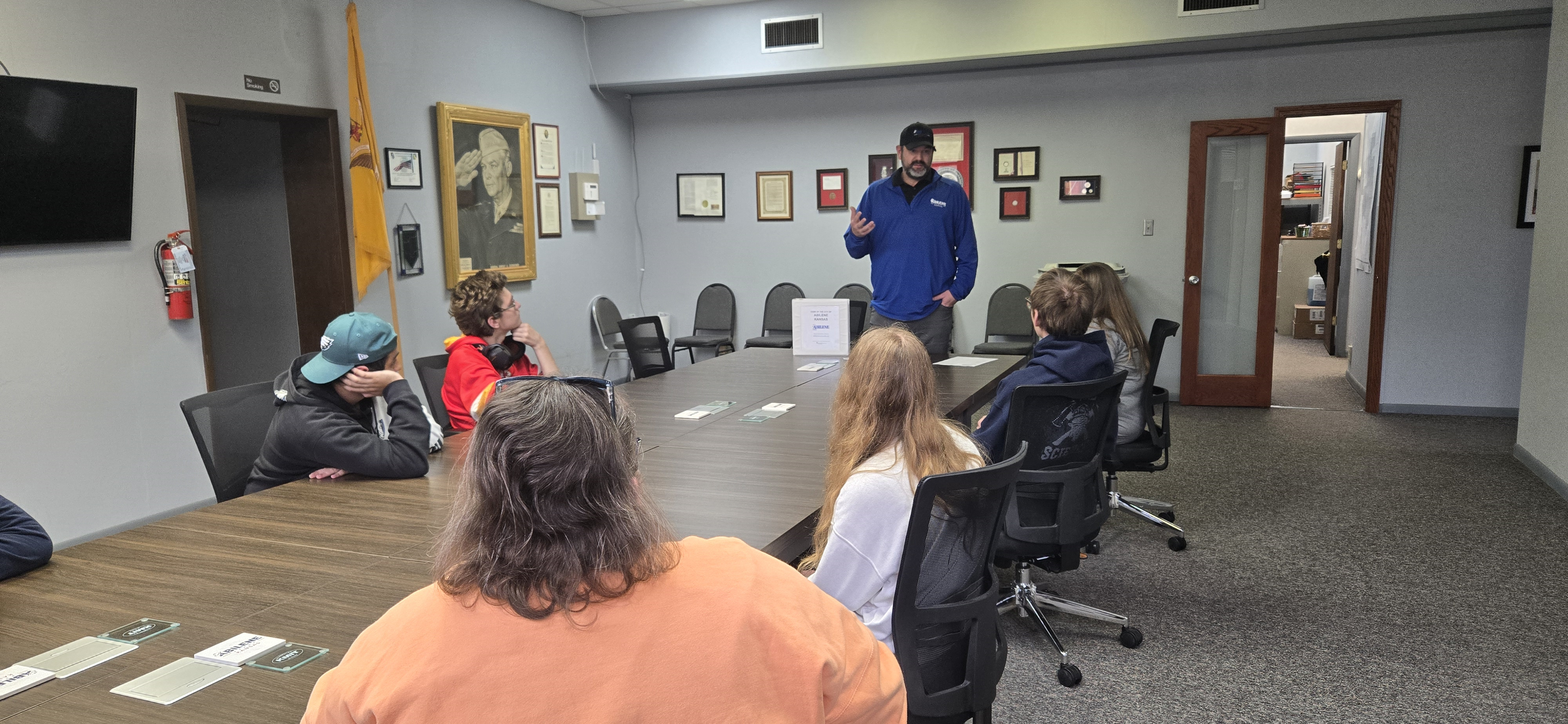 ity Inspector Travis Steerman talks with students at City Hall.